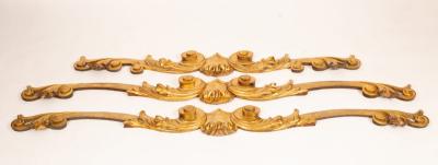 A set of three carved giltwood