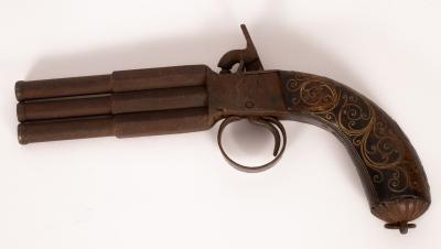 A triple barrel percussion cap pistol