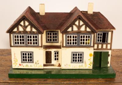 A 1930s dolls house, with twin gable