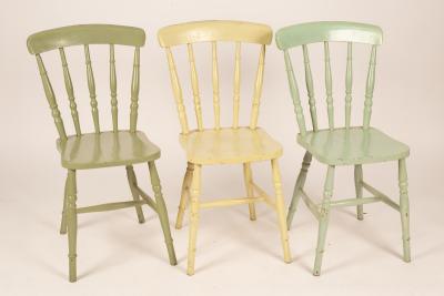 Three stick back kitchen chairs and
