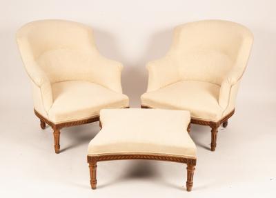 A pair of upholstered armchairs and