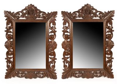 A pair of oak framed wall mirrors 2db233