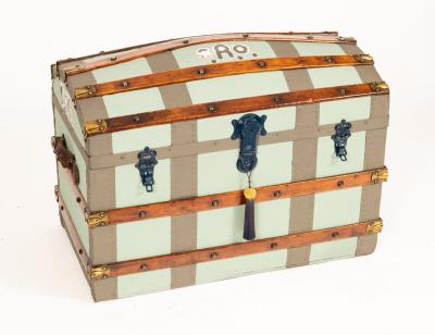 A blue painted dome top cabin trunk,