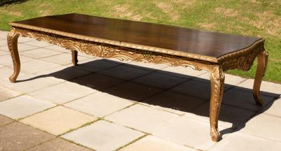 A George I style dining table of