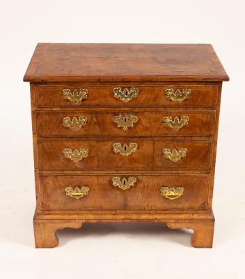 A George I walnut chest, the crossbanded