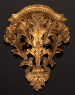 A carved gilt wood wall bracket