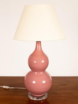 A ceramic table lamp of double