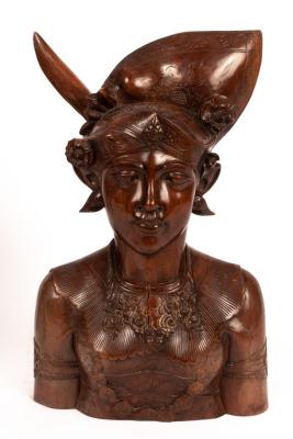 A Barle carved wood figure of a female