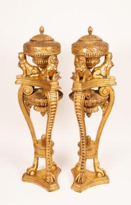 A pair of French style urns and covers