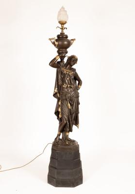 A spelter figural floor lamp modelled