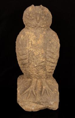 A stone figure of an owl, 49cm