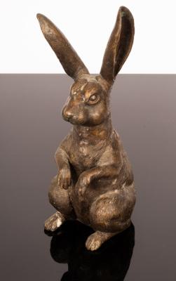 A bronze figure of a seated hare,