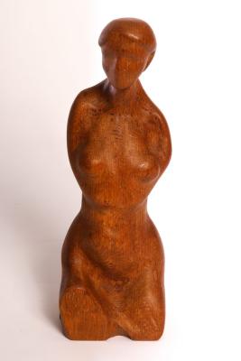 A carved wooden figure of a nude woman,