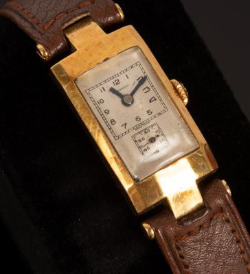 A Longines gold watch with leather strap