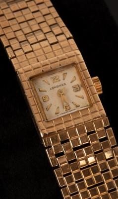 A Longines gold watch with gold bracelet
