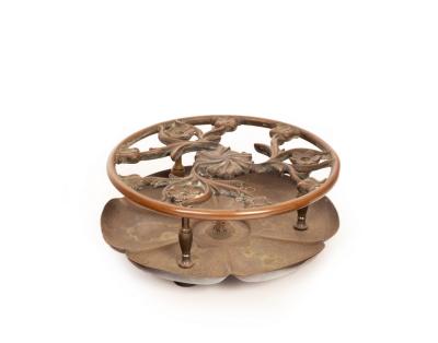 A Christopher Dresser trivet with 2db442