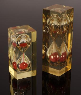 Two mid-Century lucite hourglass sand