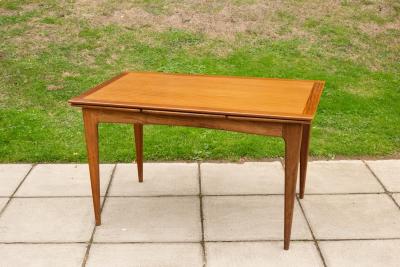 A Younger extending teak dining table,