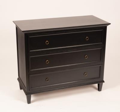 An ebonised chest of three long