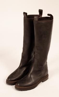 A pair of long brown leather boots,