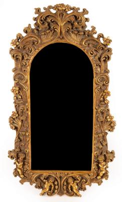 A gilt framed mirror, decorated foliate