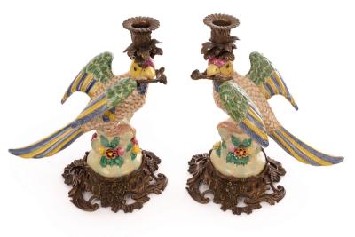 A pair of candle holders modelled as