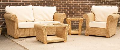 A wicker two-seater sofa, an armchair