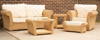 A wicker two-seater sofa, an armchair,