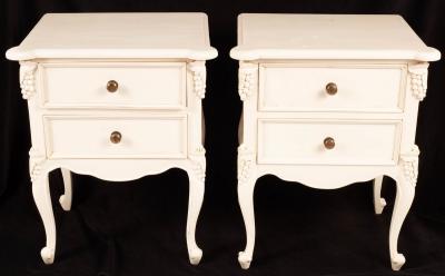 A pair of painted bedside tables,