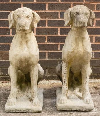 A pair of composition stone figures