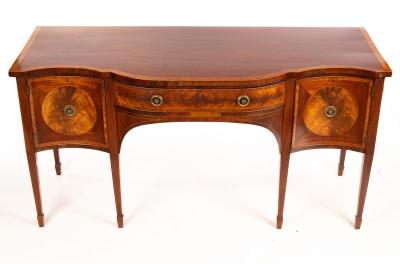 A mahogany serpentine front sideboard,