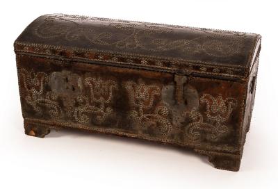 A leather covered trunk with studded