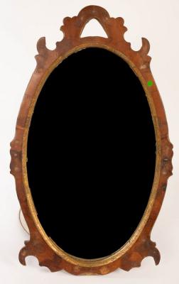 An oval mahogany wall mirror with