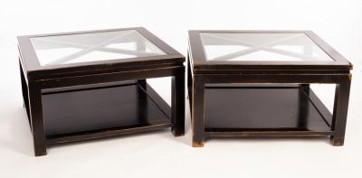 A pair of ebonised coffee tables with
