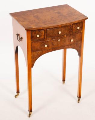 A burr yew bowfronted side table,