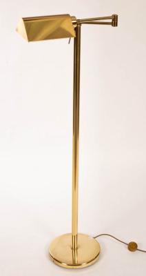 An adjustable brass reading lamp, 125cm