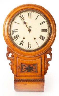 An American walnut wall clock with