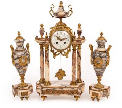 A French clock garniture of veined