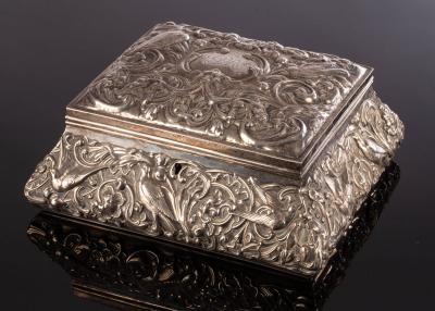 An embossed silver trinket box  2db6cb