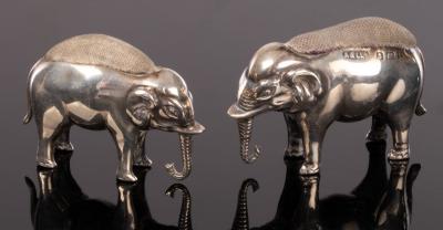 Two silver elephant pin cushions,