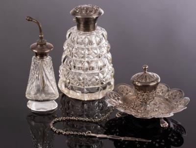 A cut glass silver topped scent