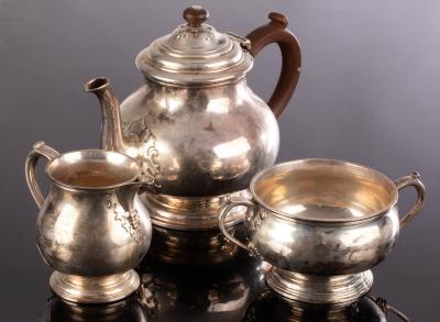 A three-piece silver tea service,
