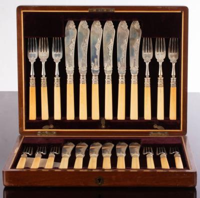 A set of twelve silver fish knives and