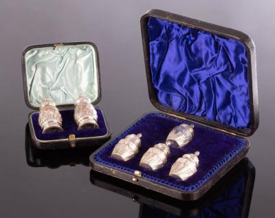 A cased pair of silver pepper pots  2db704