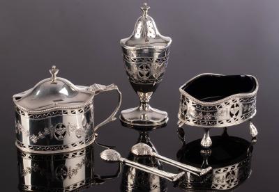 A silver three piece cruet set, C J