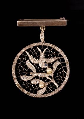 A diamond and pearl pendant of openwork