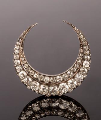 A Victorian diamond crescent brooch,
