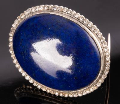 A lapis lazuli and diamond brooch, the
