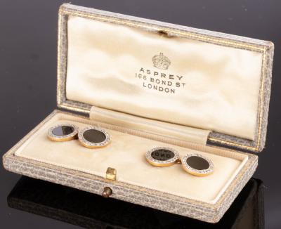 A pair onyx and diamond cufflinks,