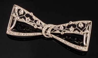 A diamond set bow brooch of openwork 2db7ba